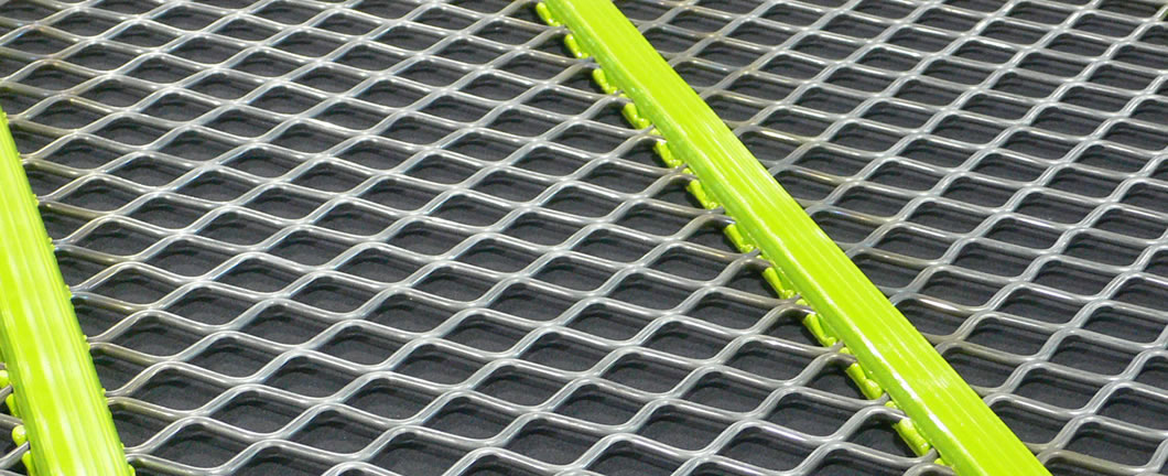 A piece of self cleaning screen mesh with the polyurethane cover